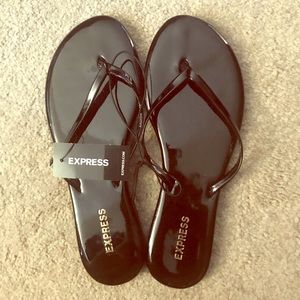 NWT Express Shiny Black Flip Flop Sandals